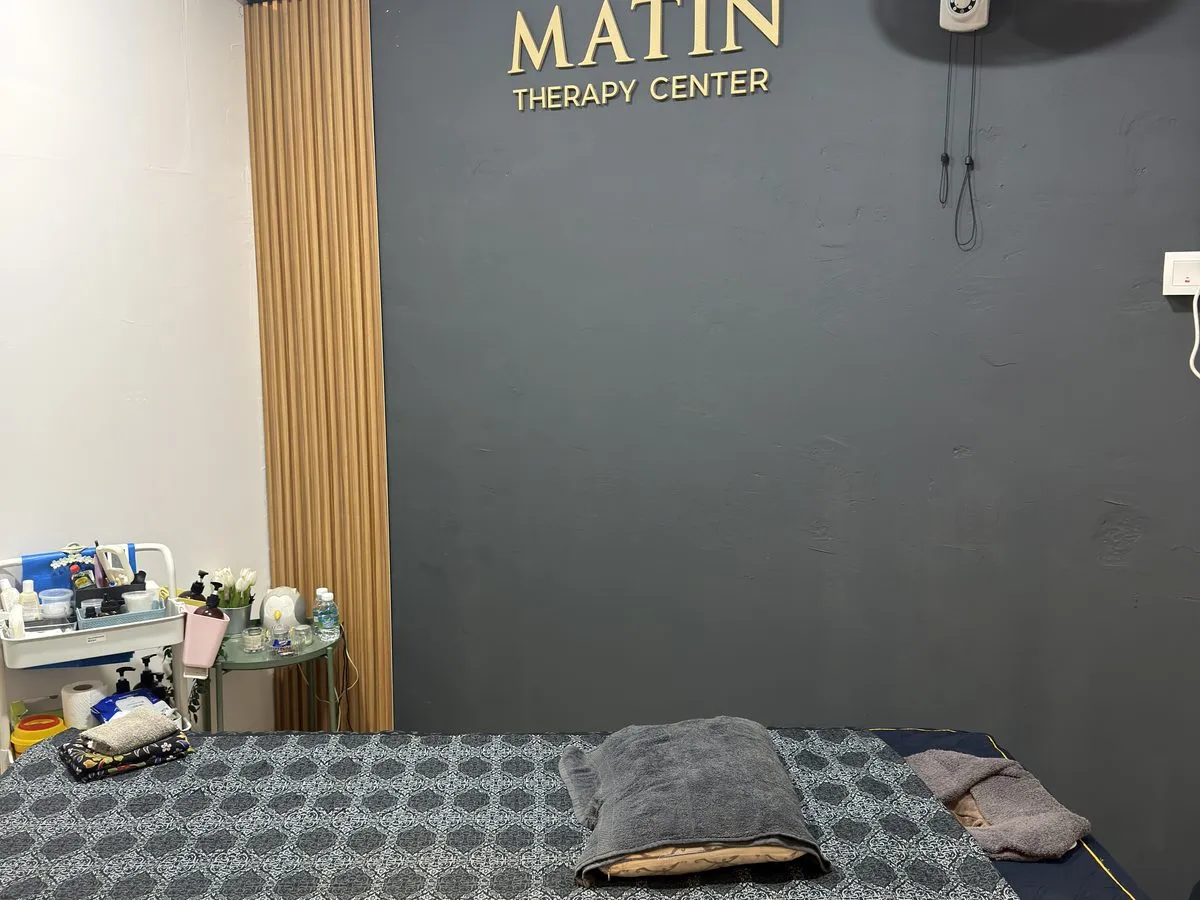 Renovated private treatment room — MATIN THERAPY CENTER wall, clean linens (IMG_1061, centre crop 4:3)